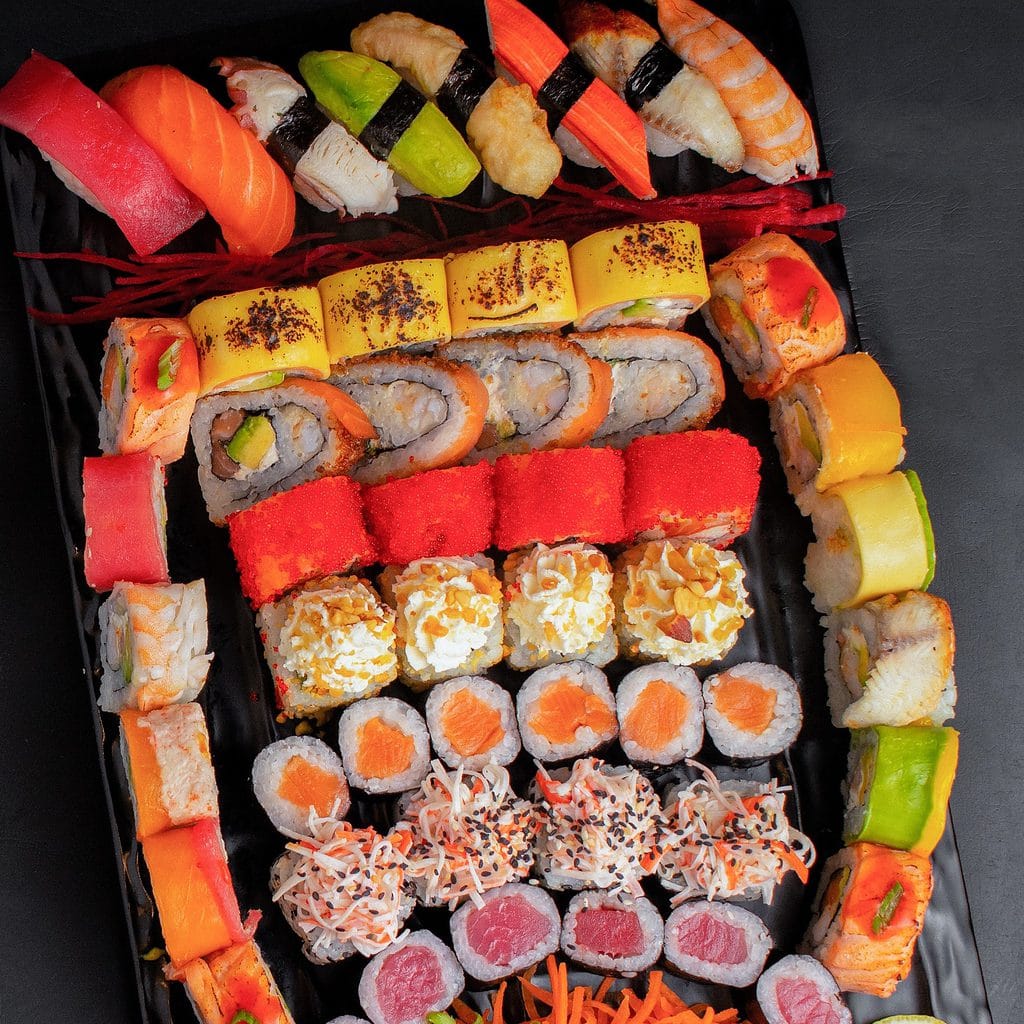 Colorful selection of different sushi variations for several people